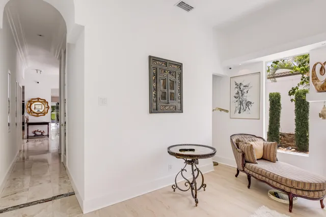 a view of a hallway with elevator and windows