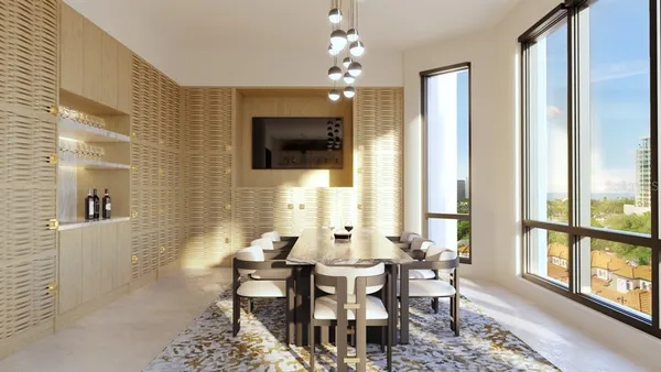 a living room with furniture a flat screen tv and a large window