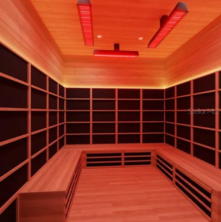 a view of a room with shelves and wooden floor