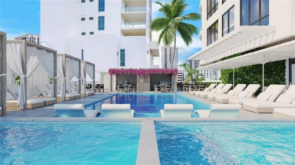 a view of a patio with couches and a fire pit