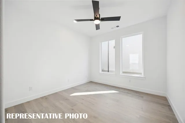a view of room with a ceiling fan