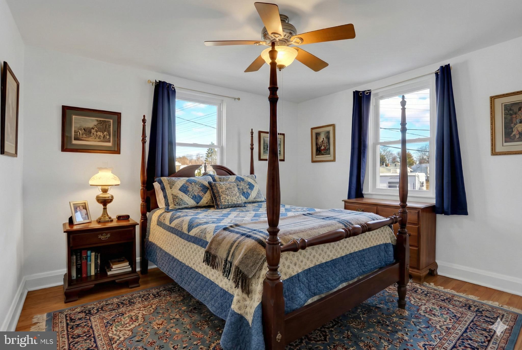 9036 Simms Court Parkville, MD 21234 - Photo 19 of 52 a bedroom with a bed and a chandelier