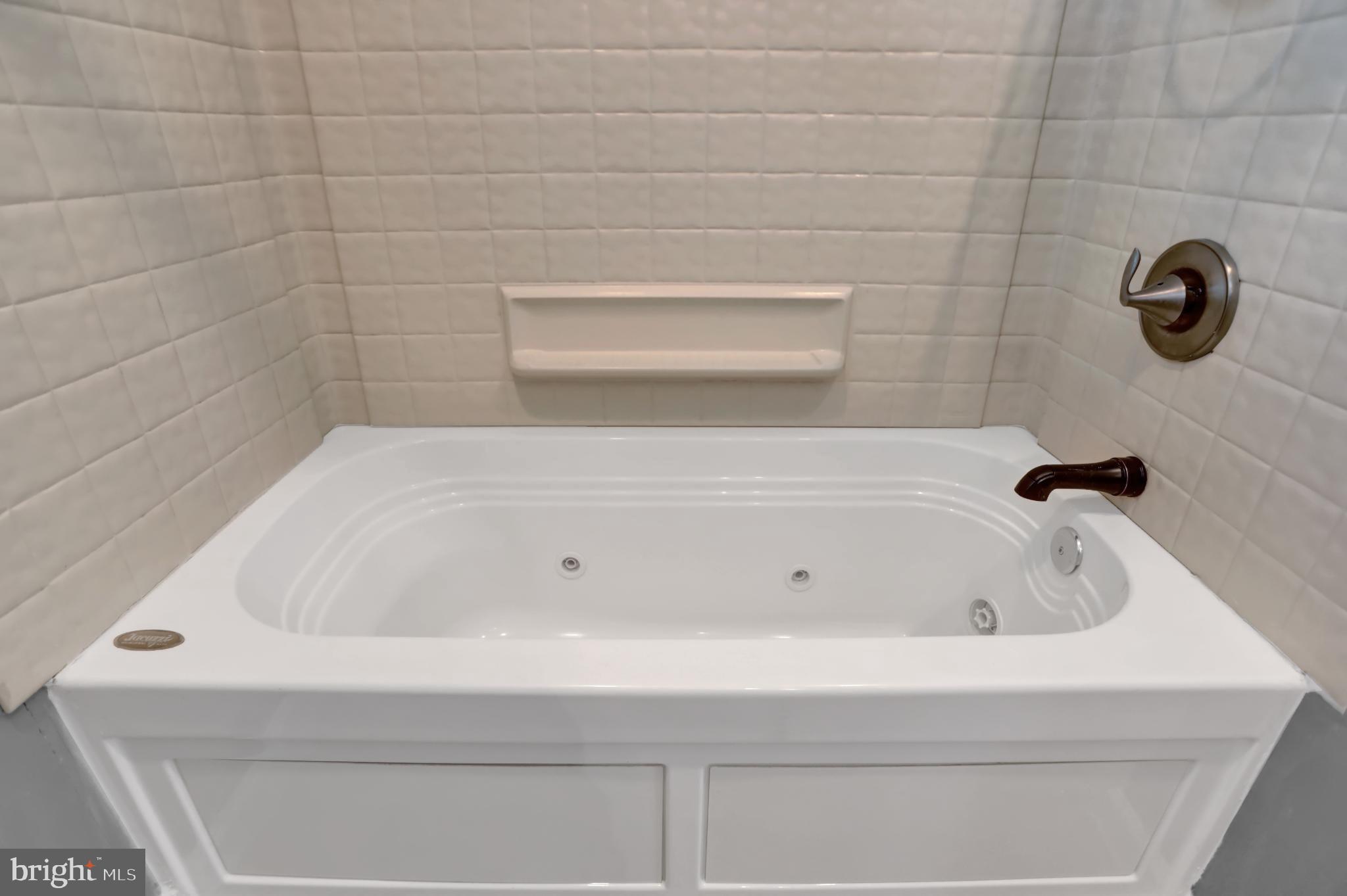 9036 Simms Court Parkville, MD 21234 - Photo 24 of 52 a bathroom with a bathtub