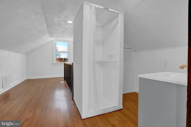 a kitchen with stainless steel appliances a refrigerator stove and microwave