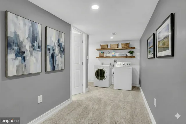 a view of a kitchen with a sink and a refrigerator