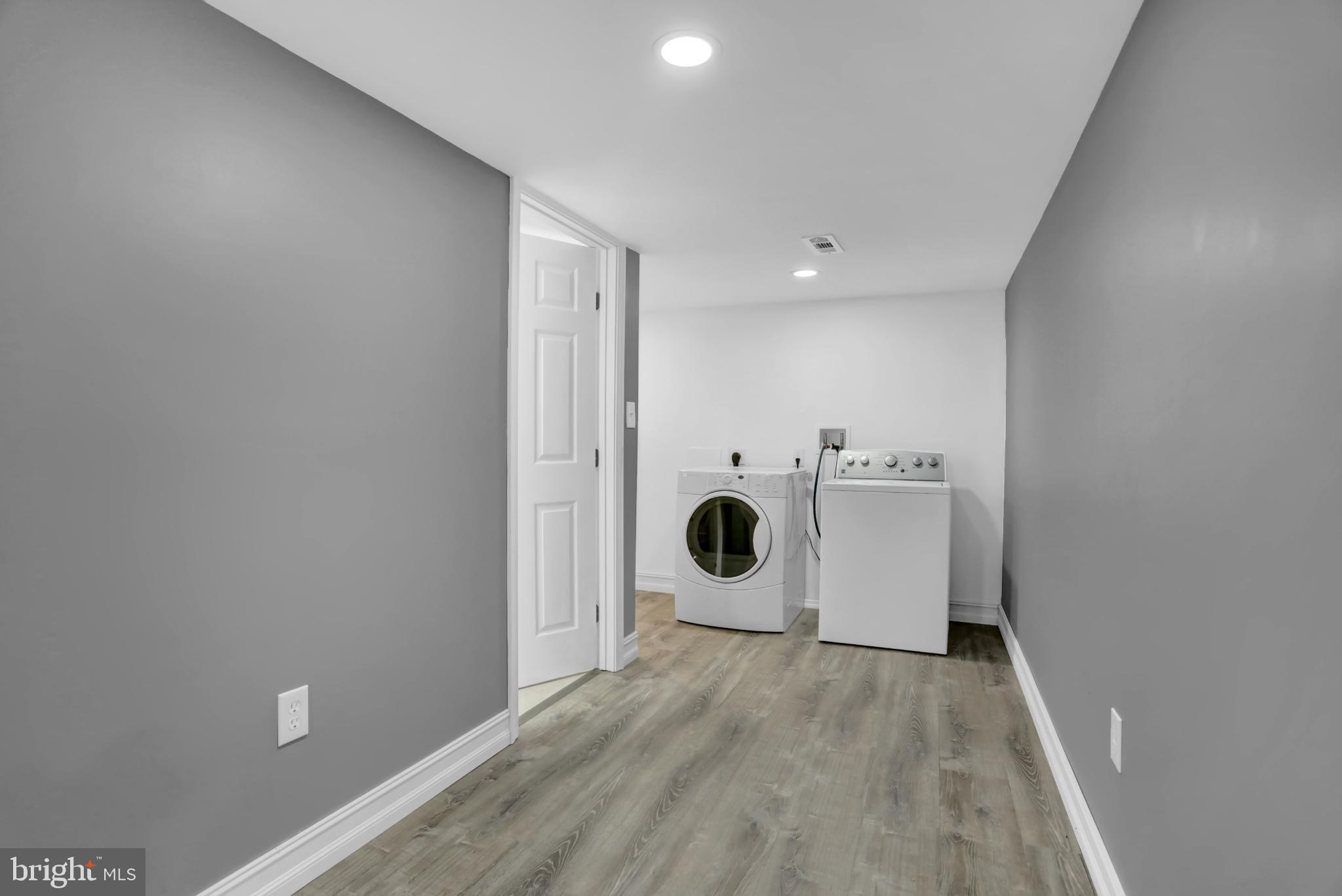 9036 Simms Court Parkville, MD 21234 - Photo 44 of 52 a view of a kitchen with a sink and a refrigerator