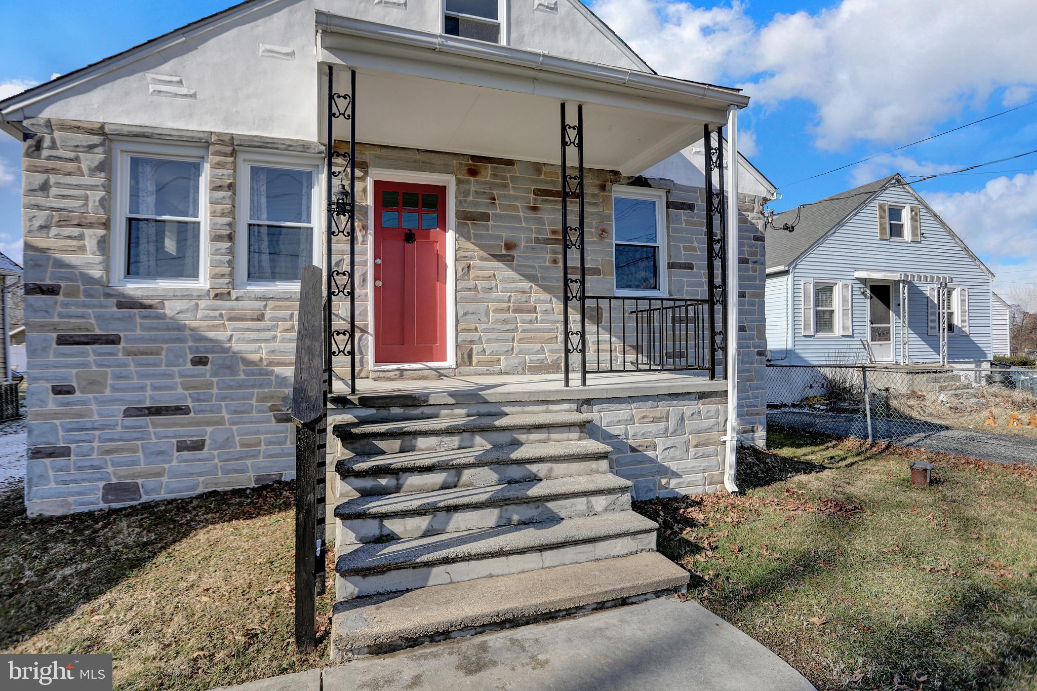 9036 Simms Court Parkville, MD 21234 - Photo 49 of 52 a front view of a house with a yard
