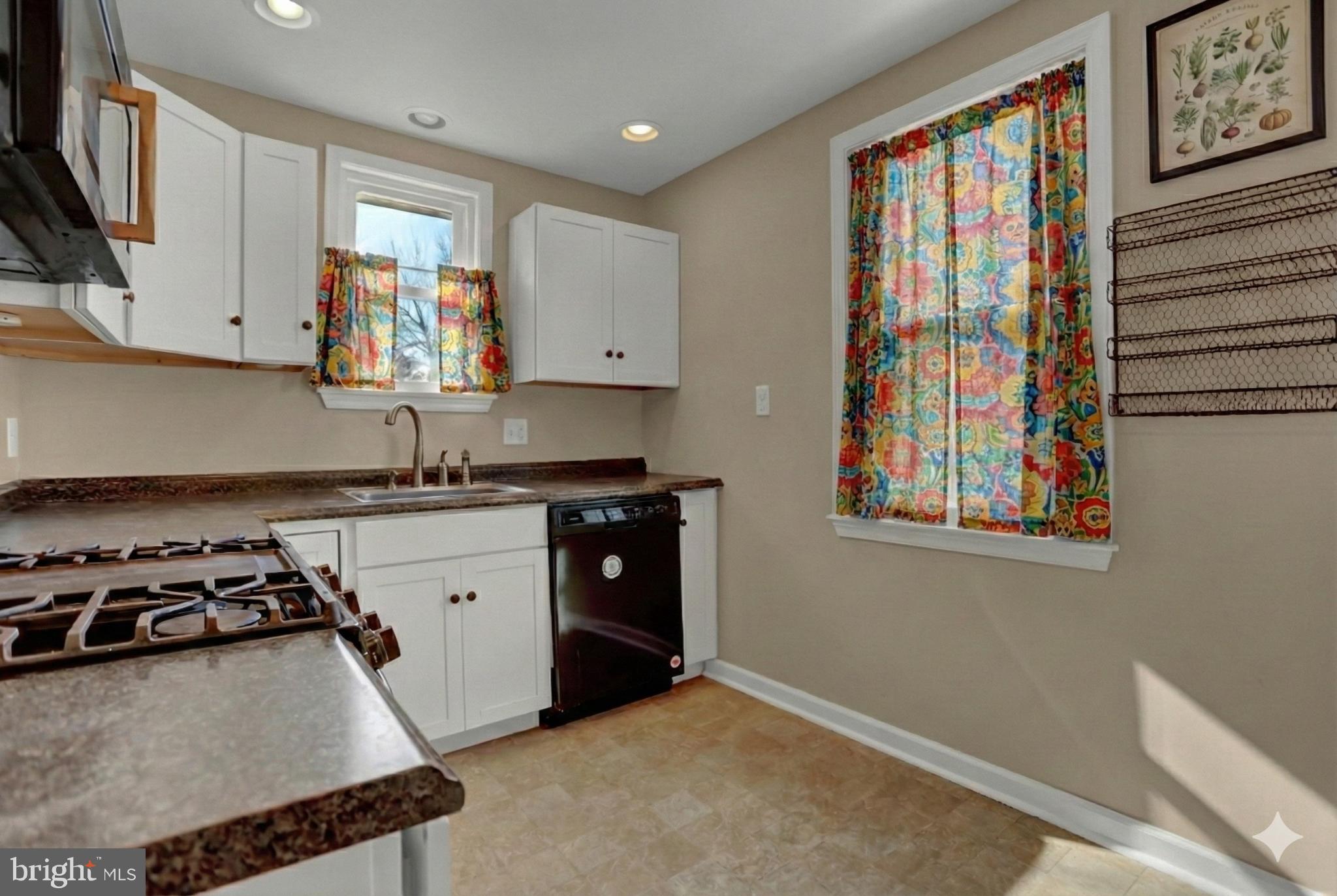 9036 Simms Court Parkville, MD 21234 - Photo 10 of 52 a kitchen with stainless steel appliances granite countertop a stove a sink and a refrigerator