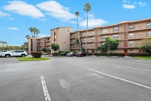 a view of a street with a building in the background