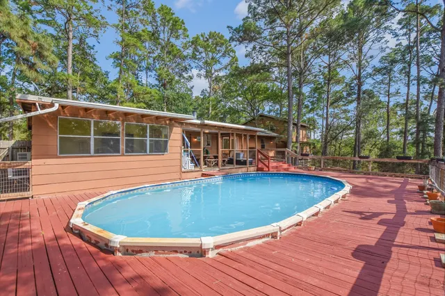 a view of swimming pool with seating space