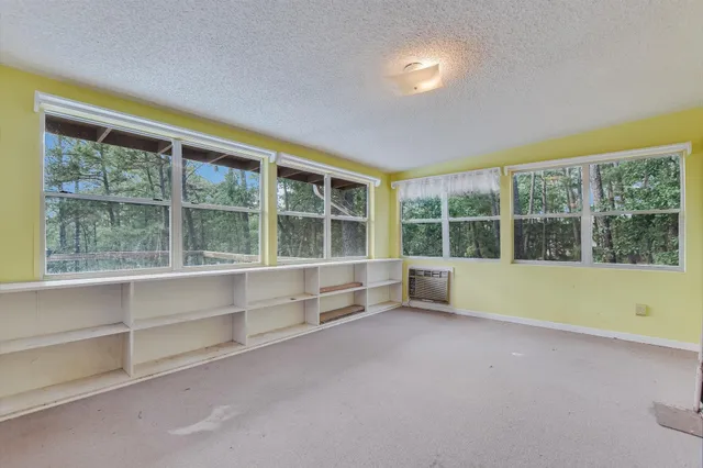 a view of an empty room with a large window