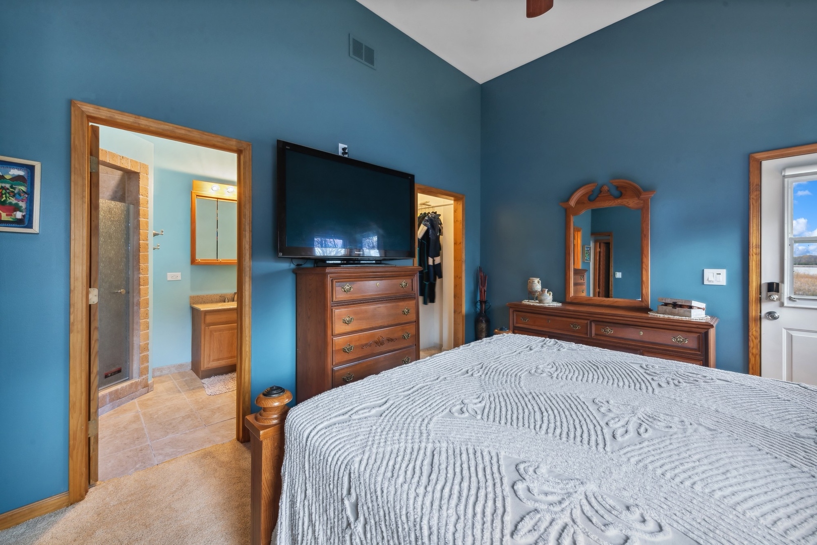 38361 North Primrose Path Spring Grove, IL 60081 - Photo 13 of 30 a bedroom with bed and flat tv screen on dresser