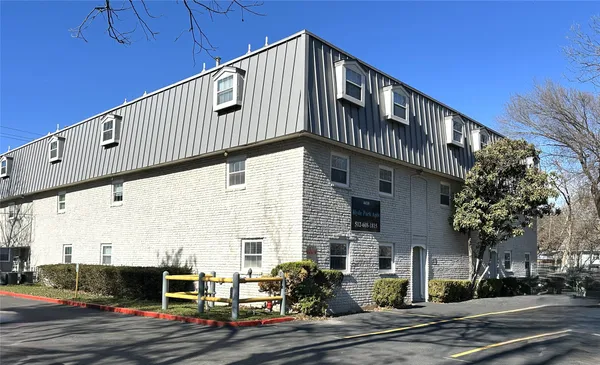 a front view of a building with street view