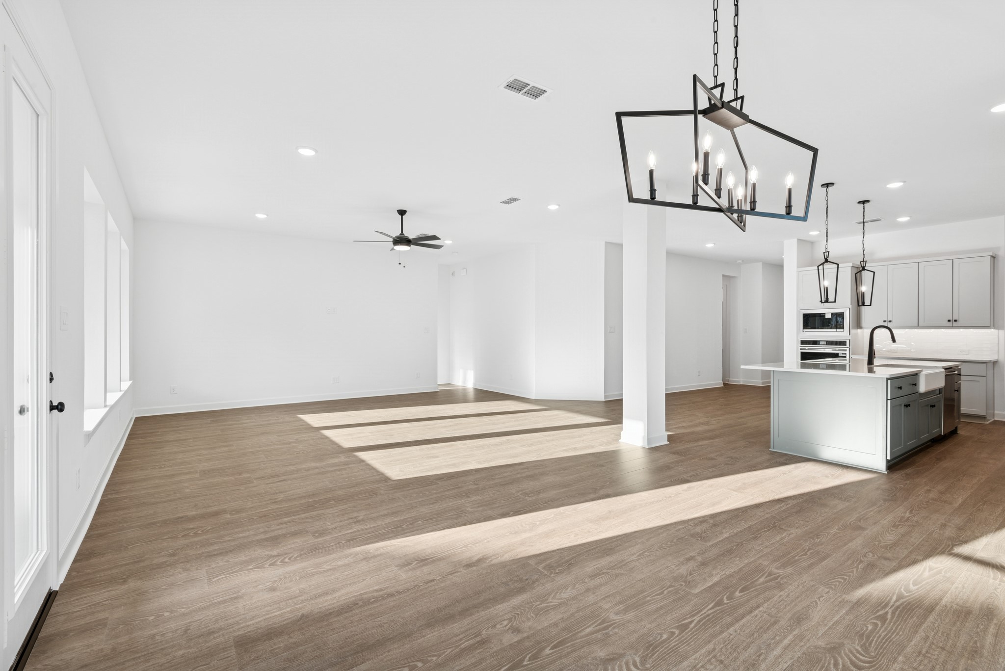 15714 Terracotta Terrace Lane Conroe, TX 77302 - Photo 31 of 47 a view of a kitchen with wooden floor and windows