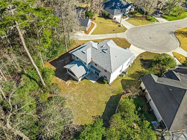 an aerial view of residential houses with outdoor space