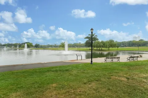 a view of a lake with houses in the background