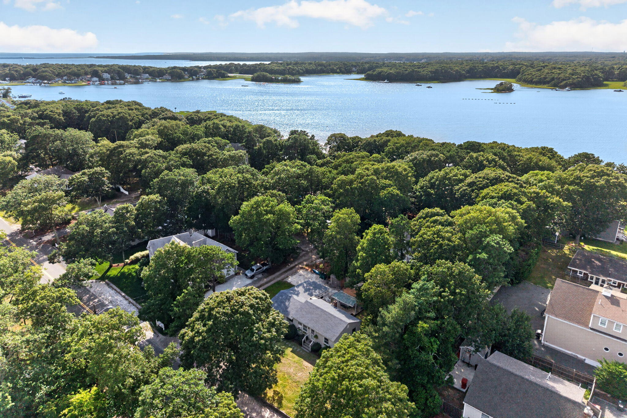 203 Monomoscoy Road Mashpee, MA 02649 - Photo 1 of 28 25-web-or-mls-DJI_20260805043812_0321_D
