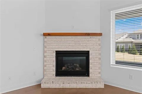 a living room with a fireplace and a fireplace