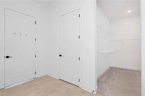 a bathroom with bathtub and window