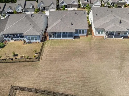 a view of an empty room with chandelier