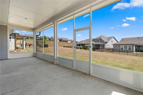 a view of an empty room with sliding glass door