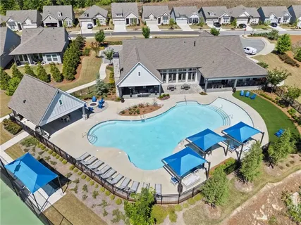 an aerial view of a house with a swimming pool