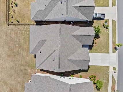 a backyard of a house with a garden and stainless steel appliances