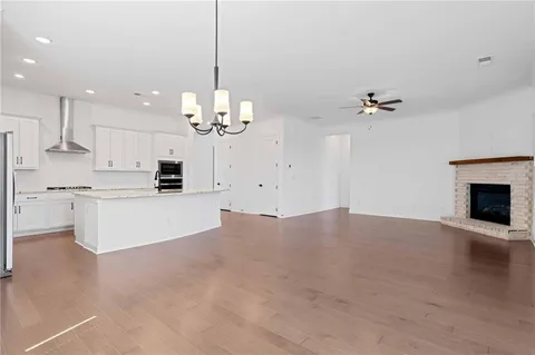 a view of a kitchen with marble kitchen and kitchen island