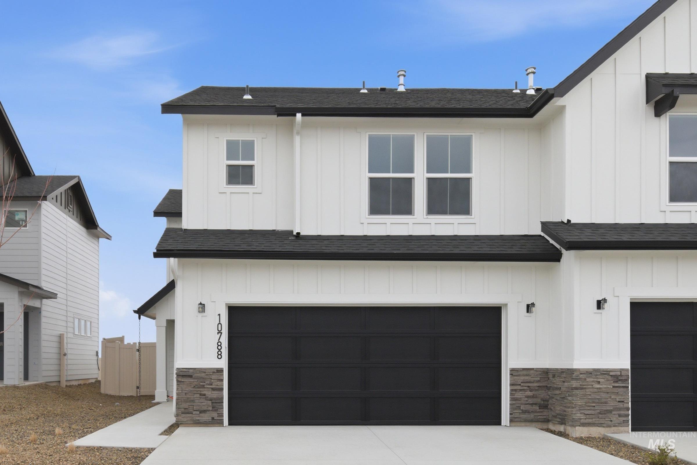 10788 Rutland Street Caldwell, ID 83605 - Photo 1 of 22 Modern farmhouse with roof with shingles, board and batten siding, and stone siding