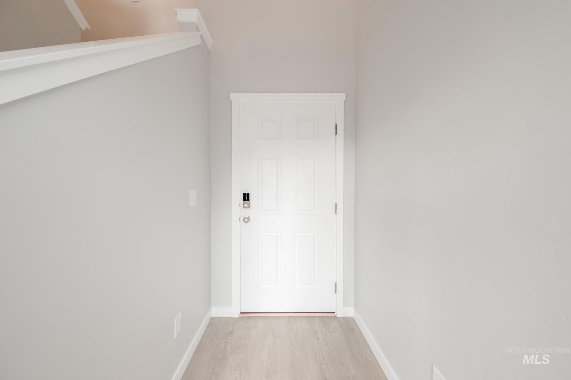 10788 Rutland Street Caldwell, ID 83605 - Photo 2 of 22 Interior space featuring baseboards and wood finished floors