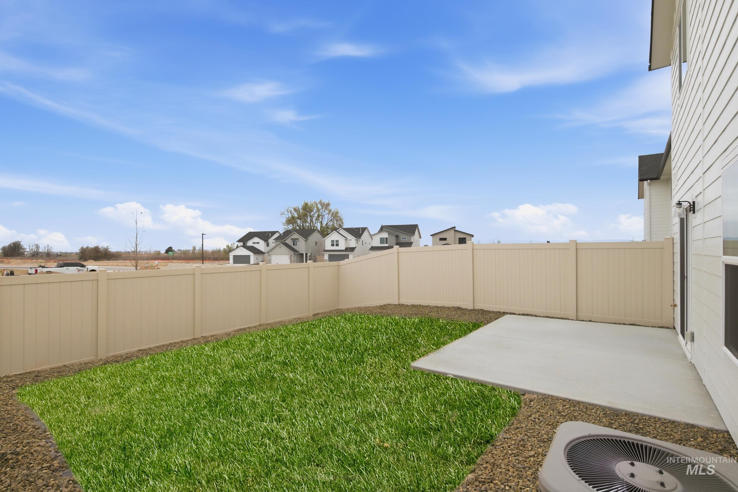 10788 Rutland Street Caldwell, ID 83605 - Photo 21 of 22 Fenced backyard with a patio and a residential view