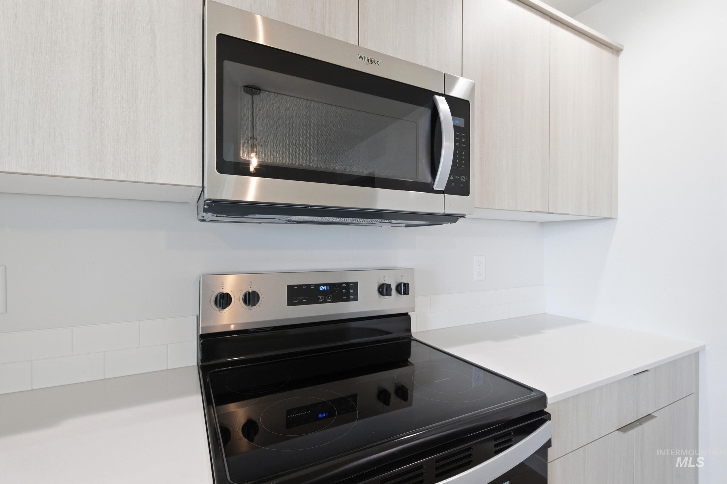 10788 Rutland Street Caldwell, ID 83605 - Photo 7 of 22 Kitchen view of stainless steel appliances, modern cabinets, and light wood finish cabinets
