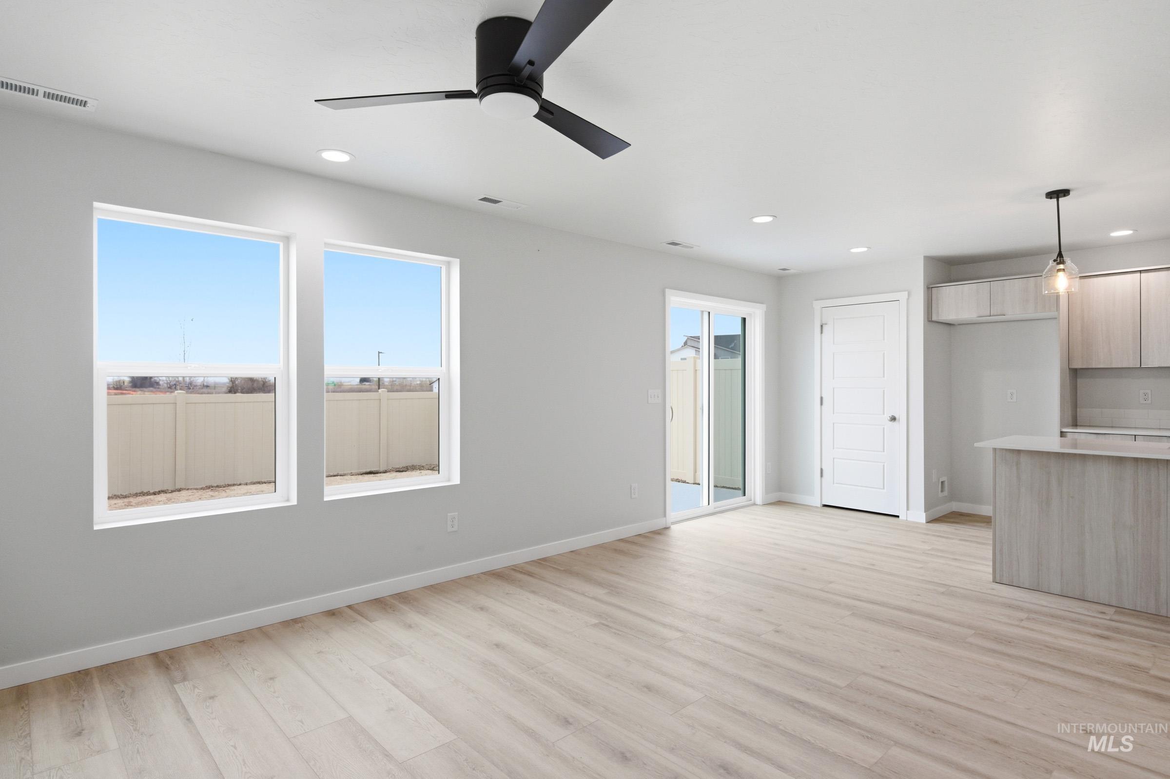 10788 Rutland Street Caldwell, ID 83605 - Photo 10 of 22 Unfurnished living room featuring light wood-style flooring, recessed lighting, and a ceiling fan