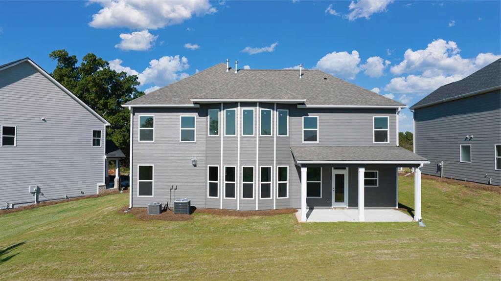 421 Hazel Drive Locust Grove, GA 30248 - Photo 2 of 28 a view of a house with a yard and a large window