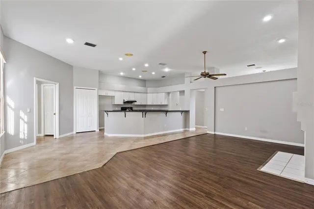 a view of kitchen with wooden floor and window
