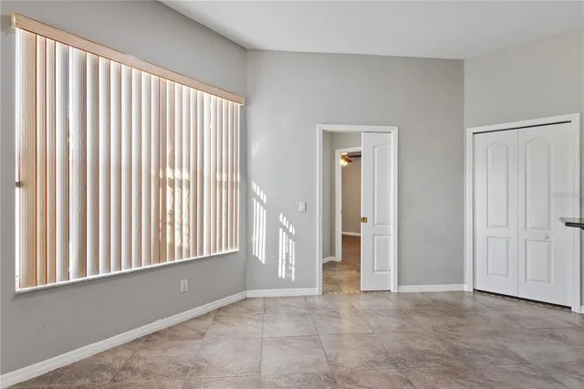 a view of an empty room with a window