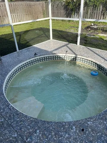 a swimming pool with yard