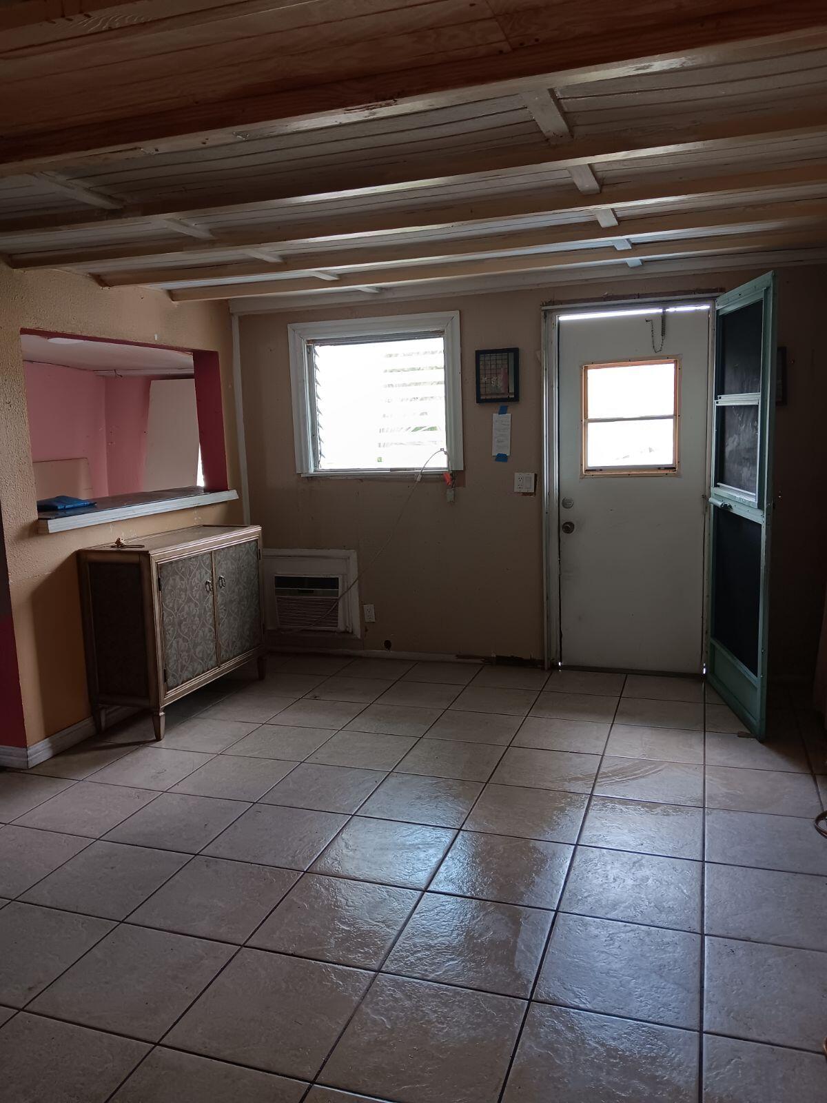 14683 Barwick Road Delray Beach, FL 33445 - Photo 4 of 6 a kitchen with a stove and a refrigerator