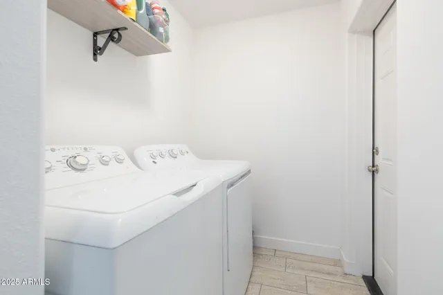 a utility room with dryer and washer