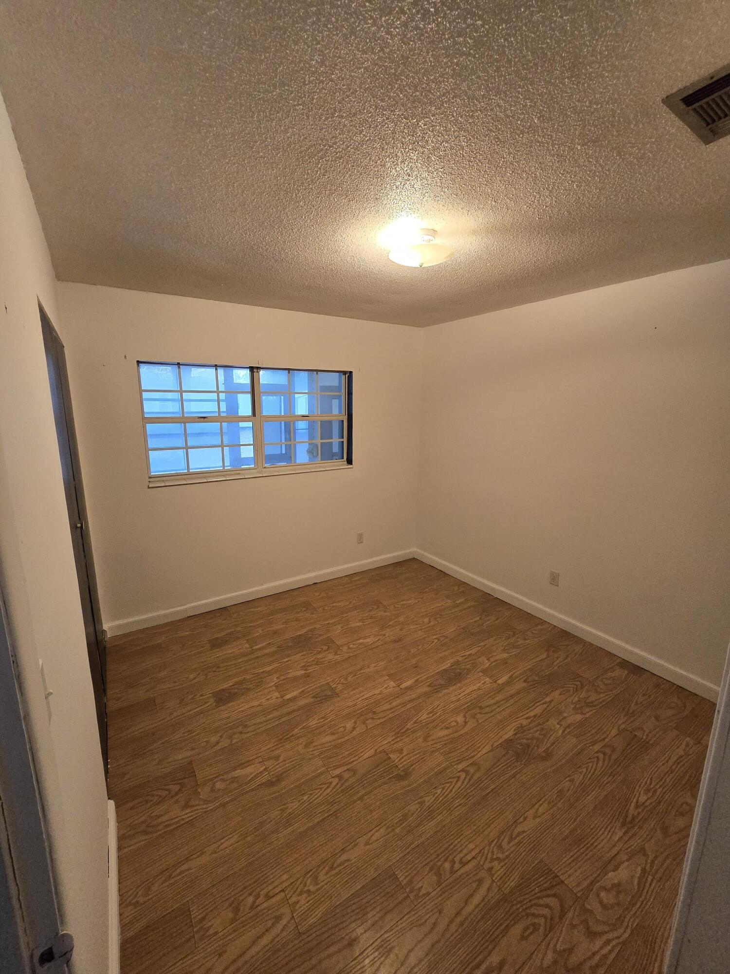 413 Ed Street Fort Walton Beach, FL 32547 - Photo 14 of 36 an empty room with a window