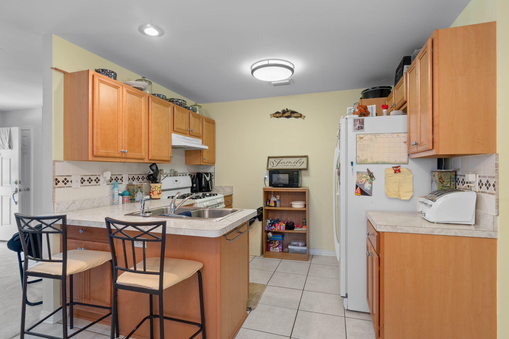 413 Ed Street Fort Walton Beach, FL 32547 - Photo 18 of 36 a kitchen with granite countertop a sink cabinets and window