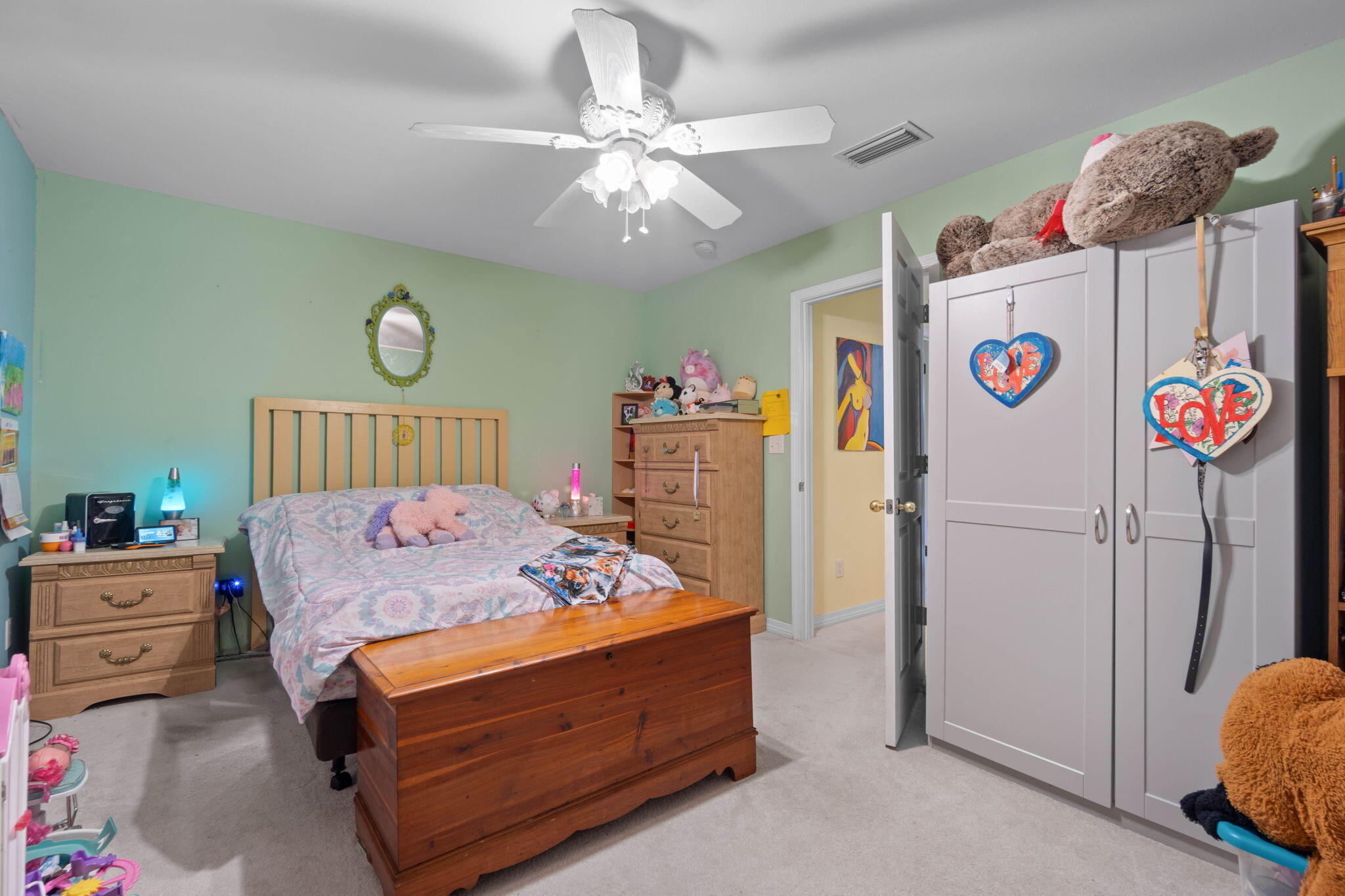 413 Ed Street Fort Walton Beach, FL 32547 - Photo 20 of 36 a bedroom with a bed and a chandelier