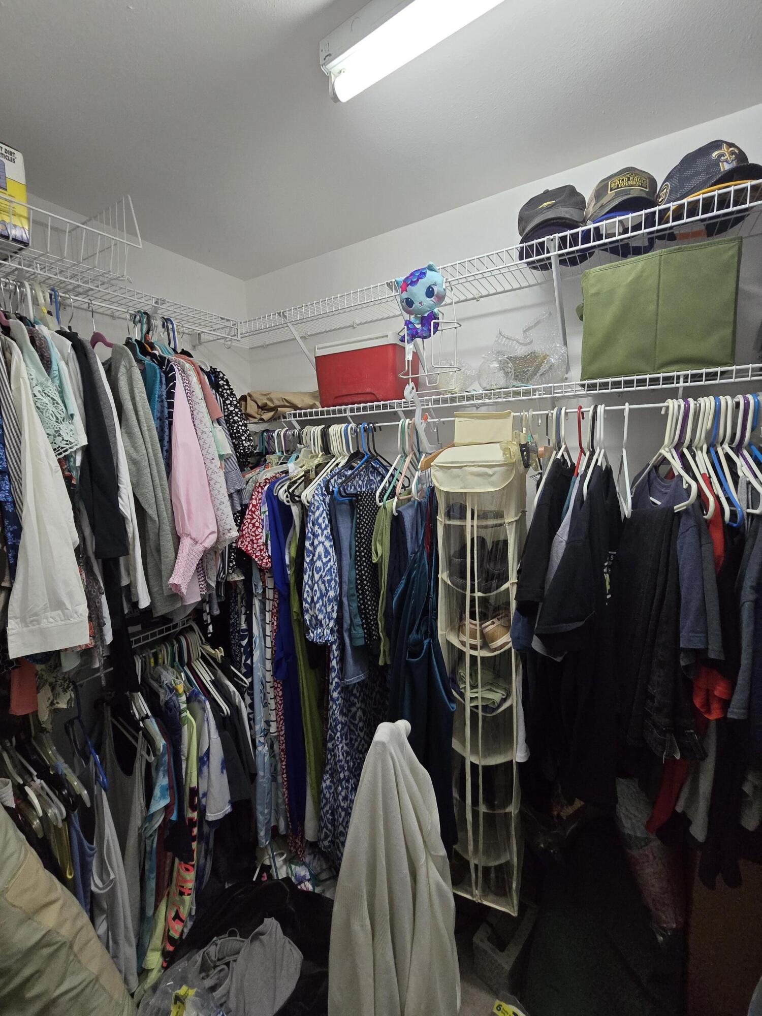 413 Ed Street Fort Walton Beach, FL 32547 - Photo 23 of 36 a view of walk in closet with clothes and shoes