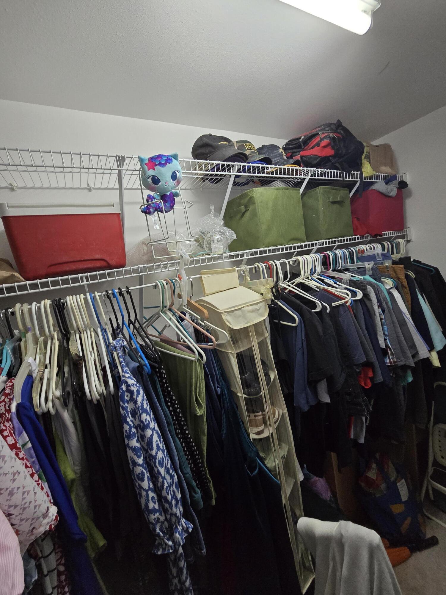413 Ed Street Fort Walton Beach, FL 32547 - Photo 24 of 36 a view of walk in closet with clothes