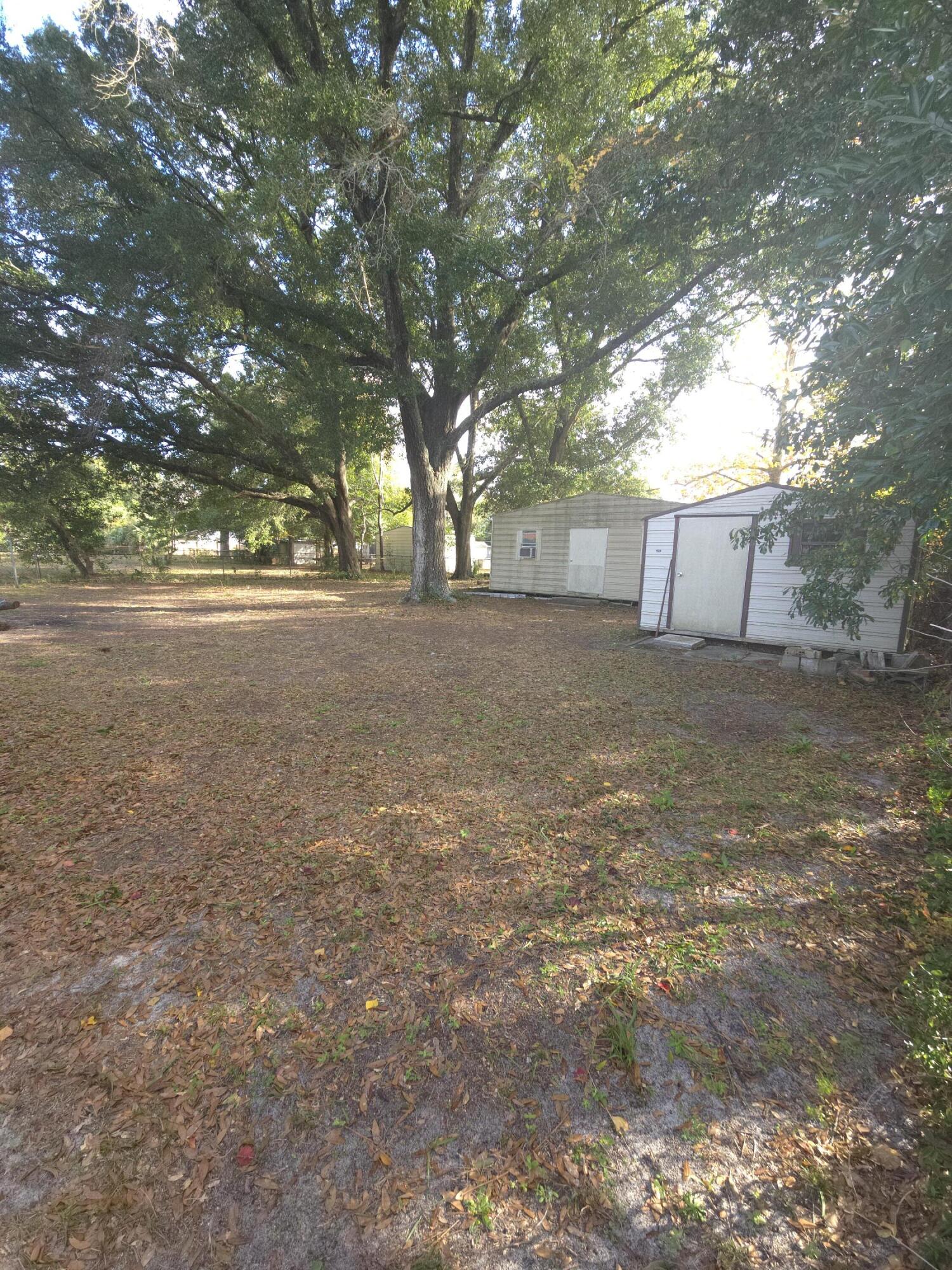 413 Ed Street Fort Walton Beach, FL 32547 - Photo 27 of 36 a view of a yard with a tree