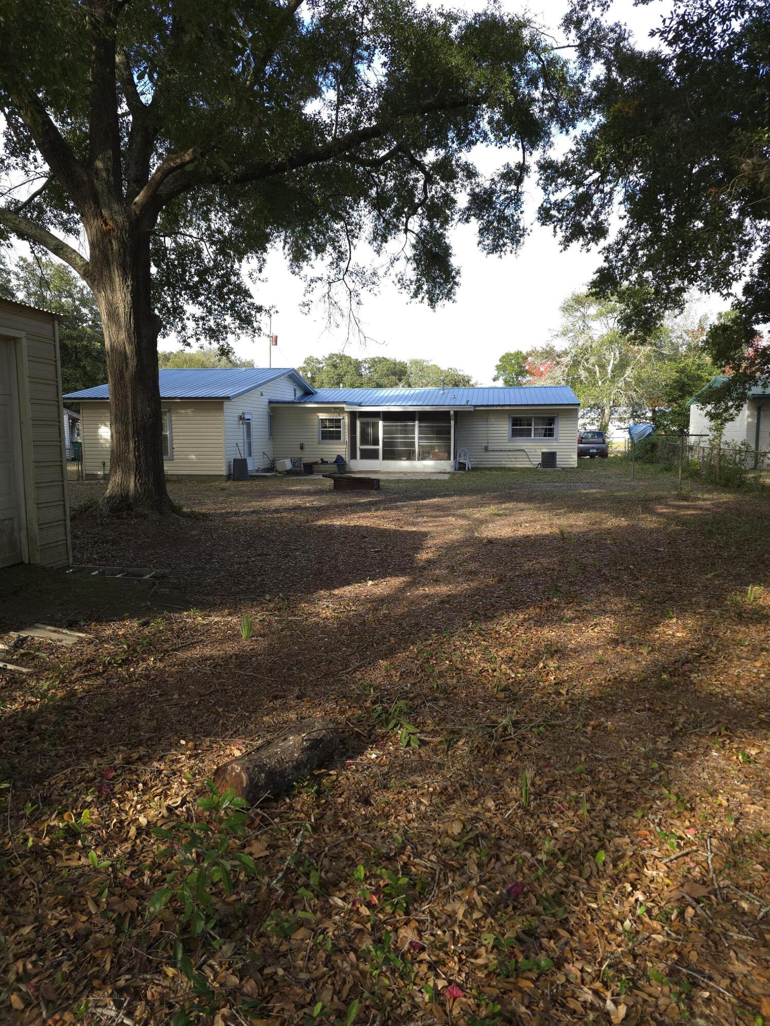 413 Ed Street Fort Walton Beach, FL 32547 - Photo 28 of 36 a front view of house with yard and trees