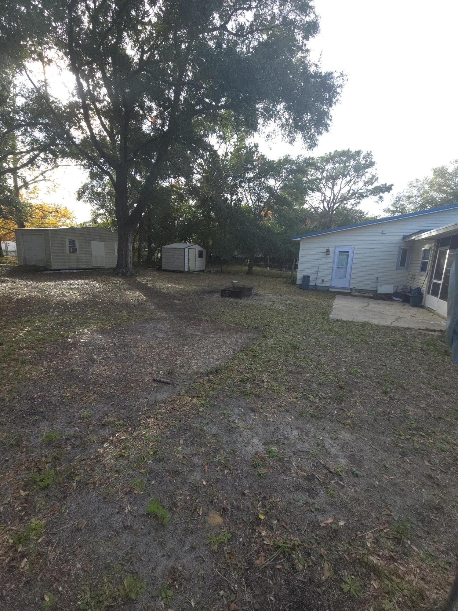 413 Ed Street Fort Walton Beach, FL 32547 - Photo 29 of 36 a view of a house with a yard