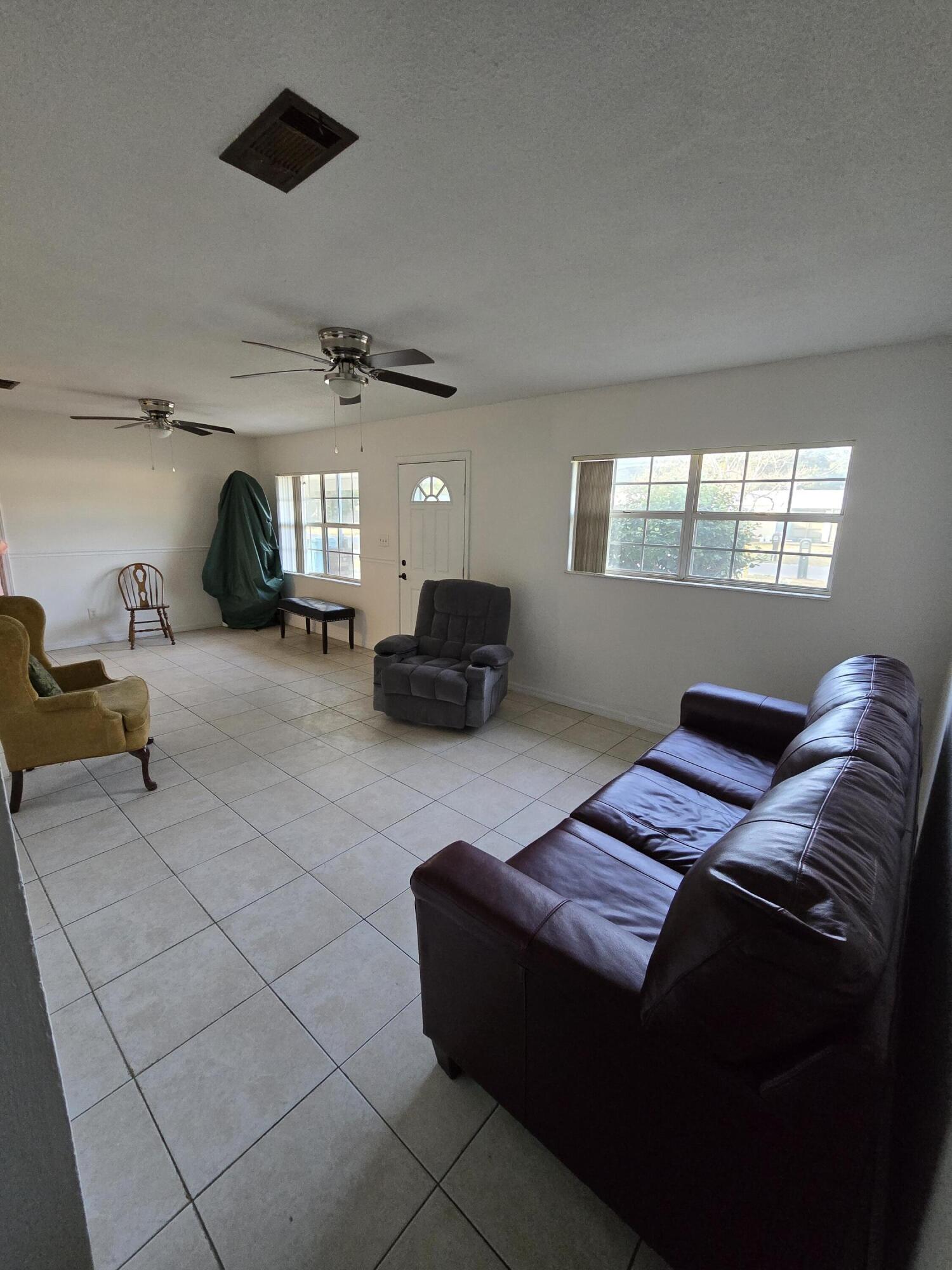 413 Ed Street Fort Walton Beach, FL 32547 - Photo 4 of 36 a living room with furniture and a window