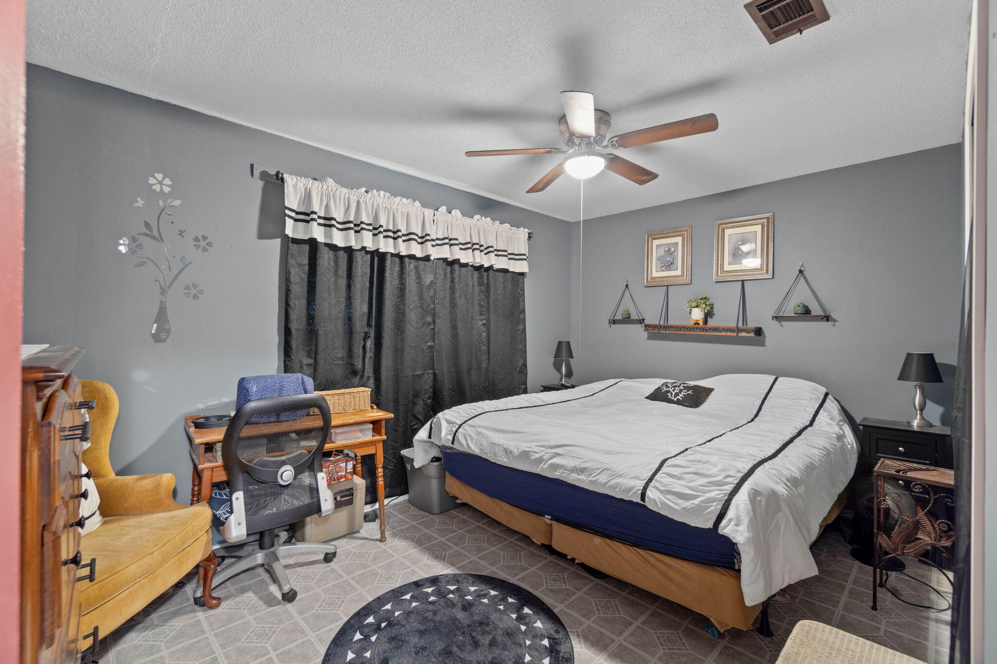 413 Ed Street Fort Walton Beach, FL 32547 - Photo 9 of 36 a bedroom with bed and a chandelier