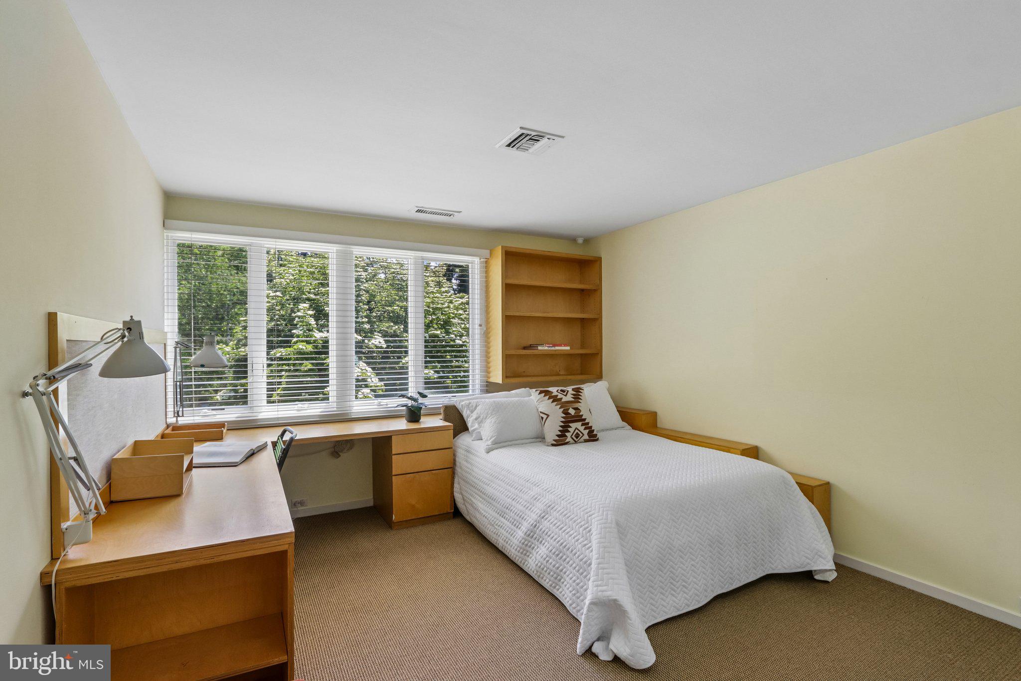 1673 Paper Mill Road Jenkintown, PA 19046 - Photo 40 of 73 a bedroom with a bed and large windows